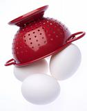 Red Colander with Fresh Eggs