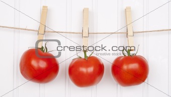 Summer Tomatoes Hanging from a Clothesline