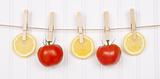 Summer Lemon Slices and Tomatoes Hanging from a Clothesline