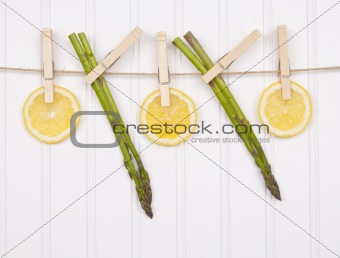 Summer Lemon Slices and Asparagus Hanging from a Clothesline