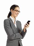 Young confident business woman texting on phone