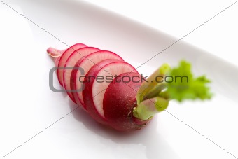 Sliced red radish on white background