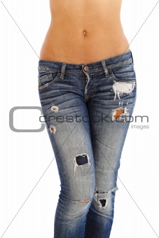Young woman with bare top wearing worn jeans
