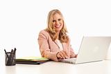 Young businesswoman with laptop at desk