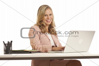 Young businesswoman with laptop at desk