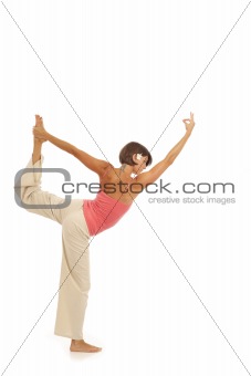 Young woman doing yoga Dancer Pose