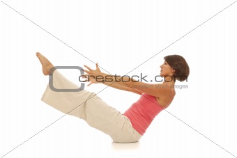 Young woman doing yoga Navasana Boat Pose