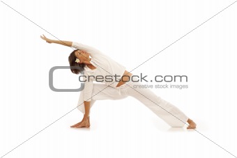 Young woman doing yoga Side Angle Pose