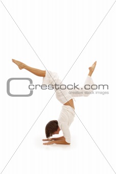 Young woman doing yoga Forearm Balance
