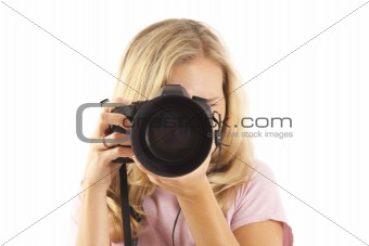 Young woman with camera taking a picture