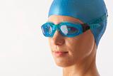 Close up portrait of young woman with swim cap and  swimming goggles