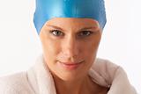 Close up portrait of young woman with swim cap and  swimming towel