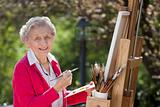 Smiling Senior Woman Painting