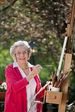 Smiling Senior Woman Painting