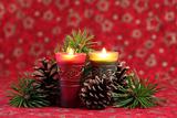 Christmas arrangement with candles and cones