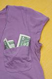 Dollar Bills in a Shirt Pocket