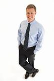 Portrait of smiling young businessman standing