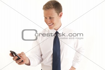 Portrait of young businessman using a cell phone