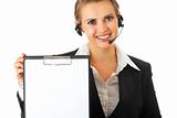 smiling modern business woman with headset and blank clipboard
