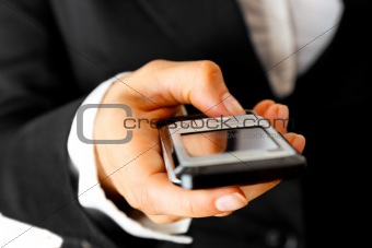 Mobile phone in  woman hand. Mobile communication.

