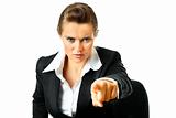 Confident modern business  female sitting on chair and pointing finger at you

