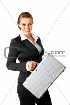 Smiling modern business woman holding  suitcase in hands

