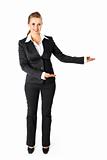 Full length portrait of smiling  business woman presenting something on empty hands
