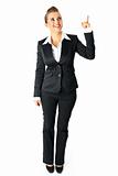 Full length portrait of smiling modern business woman pointing finger up
