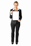 Full length portrait  of friendly modern business woman holding blank clipboard  in hands

