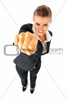 Full length portrait of furious modern business woman punching
