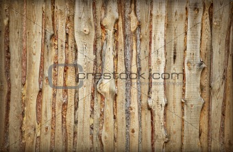Wooden fence made of boards and slabs - background