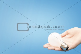 Background with lit lightbulb