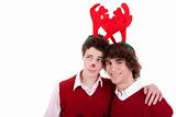 happy young men wearing reindeer horns, on white, studio shot