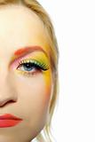 Close-up portrait of summer fashion creative face make-up in yellow
