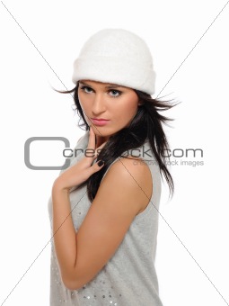 Expressions. Beautiful winter girl in a hat looking up. isolated