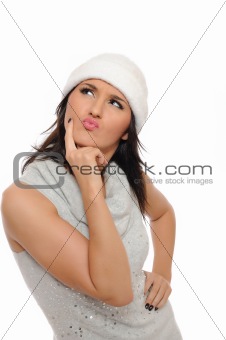 Expressions.Beautiful winter woman in a hat thinking and looking