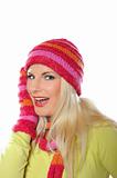Seasonal portrait of pretty funny woman in hat and gloves smiling