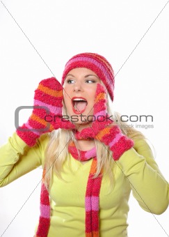 Seasonal portrait of pretty funny woman in hat and gloves scream