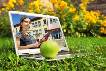 Laptop with female student on screen