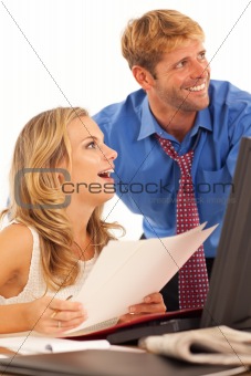 Business colleagues working at desk with computer