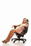 Businesswoman reclining in chair
