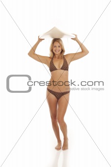 Woman surfer holding surfboard