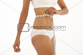 Young woman with measuring tape
