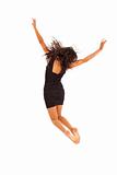 Cute young girl with black dress jumping energetically