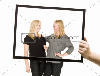 Two girls in a frame