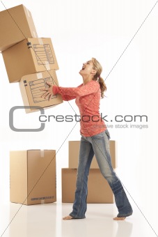 Young woman dropping cardboard boxes