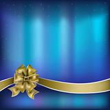 christmas greeting gold bow with ribbon on blue background