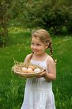 Little girl holding eggs
