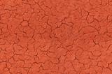 Cracked red textured surface seamlessly tileable