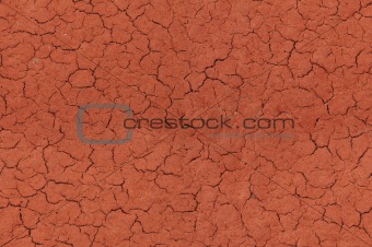Cracked red textured surface seamlessly tileable